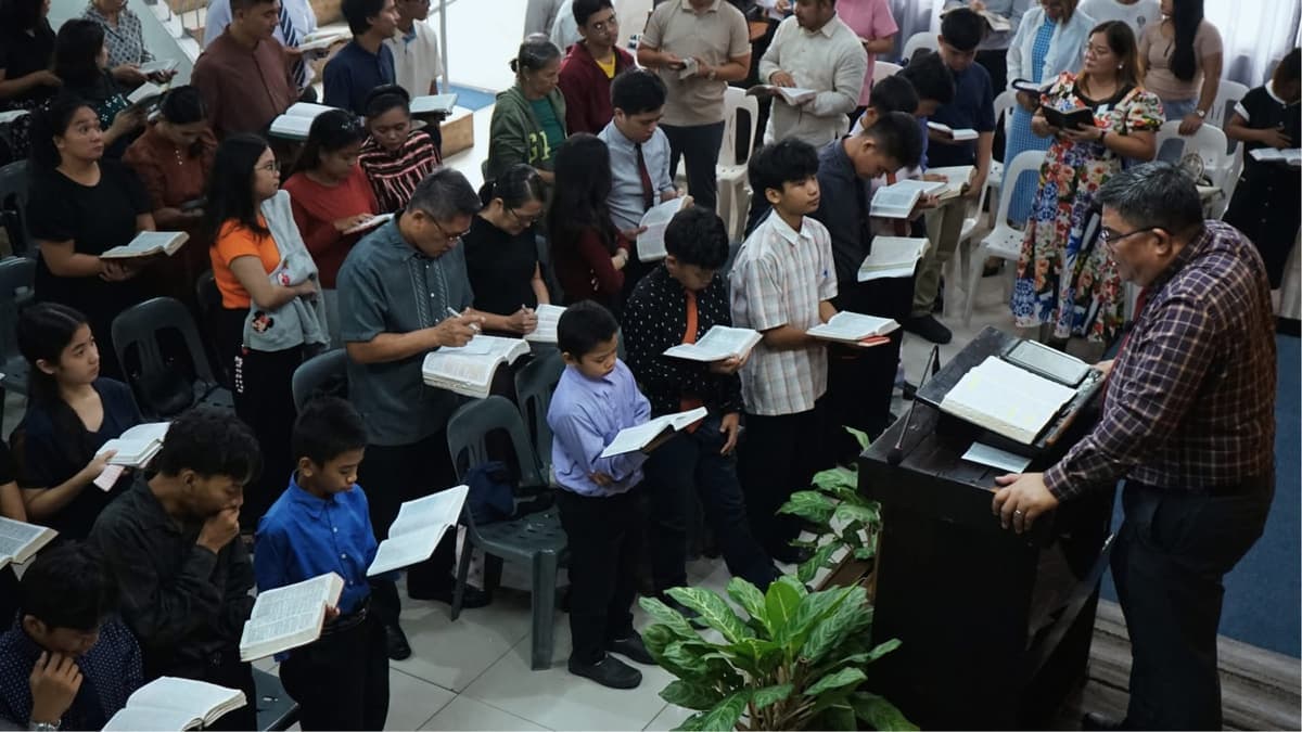 Following along with the hymnal during the service