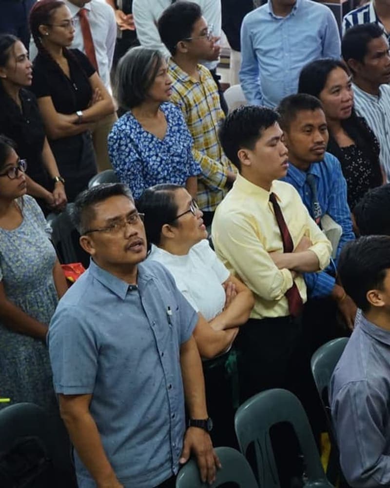 The congregation singing together on a Sunday morning